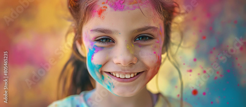 Happy smiling young girl celebrating holi festival, joyous festival, colorful face, vibrant powder paint explosion. 