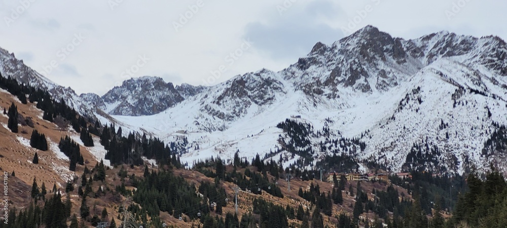 beautiful picturesque view high in the mountains, early spring, fallen covers,