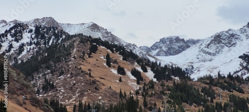 beautiful picturesque view high in the mountains, early spring, fallen covers,