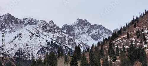 beautiful picturesque view high in the mountains, early spring, fallen covers,