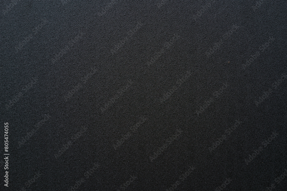 Photo of the texture of black ABS plastic. Black background with a high-resolution matte surface. Photo of the texture of black ABS plastic. Black background with a high-resolution matte surface.