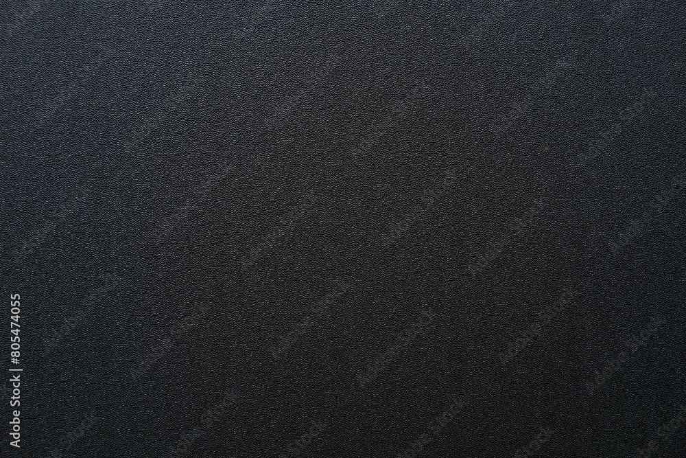 Photo of the texture of black ABS plastic. Black background with a high-resolution matte surface.