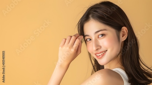 Elegant Asian Woman in Beige, with copyspace
