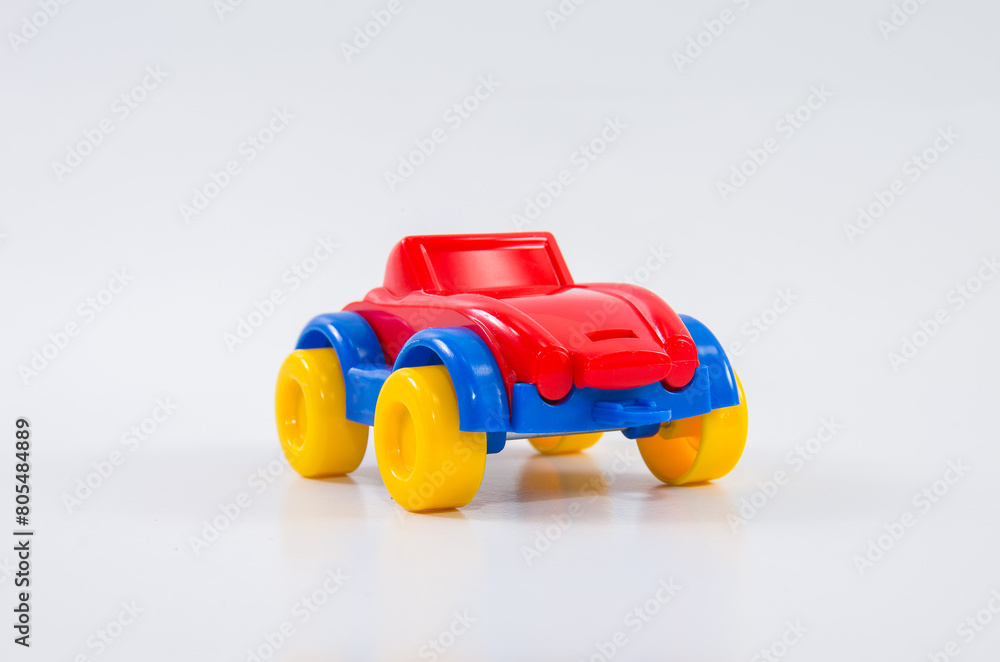Plastic toy children's racing car on a white background. Plastic toy children's racing car on a white background.