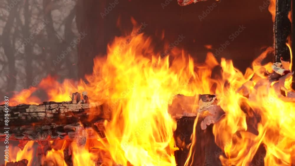 Wooden house burning. Close up of building with massive flames. Wooden house on the huge fire. Fire in an abandoned house the poor
Wooden house burning. Close up of building with massive flames. Wooden house on the huge fire. Fire in an abandoned house the poor