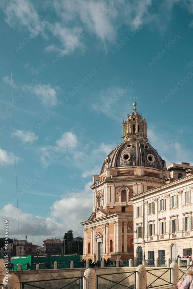 A grand, impressive building rises into the sky, its majestic dome reaching towards the heavens. The architecture exudes power and elegance, captivates with its intricate details and imposing presence