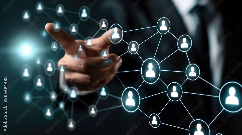 A man is pointing at a network of people on a computer screen A man is pointing at a network of people on a computer screen