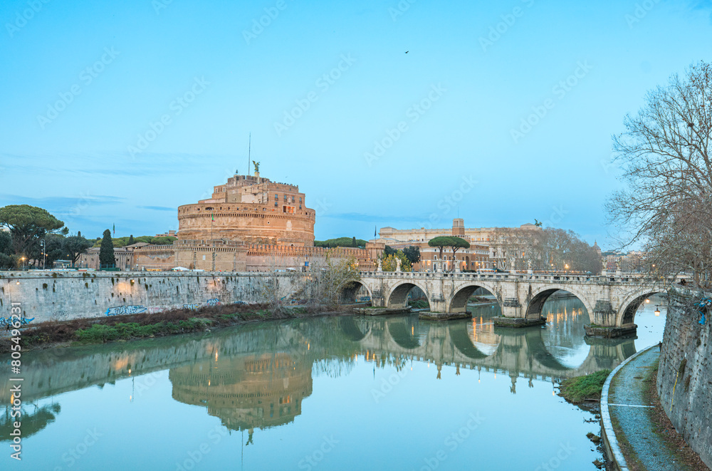 A meandering river intersects a bustling city, with a stately bridge casting a shadow over the shimmering water. The urban landscape provides a stunning backdrop to the serene scene of nature