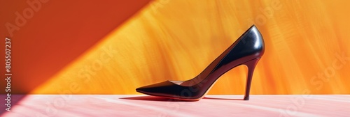 Elegant Black Stiletto Heel On Orange Background. Stylish Black High Heel For Modern Fashion Design. Generative AI photo