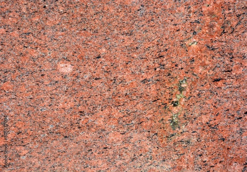 Polished granite background texture - the rock is 1.7 billion year photo