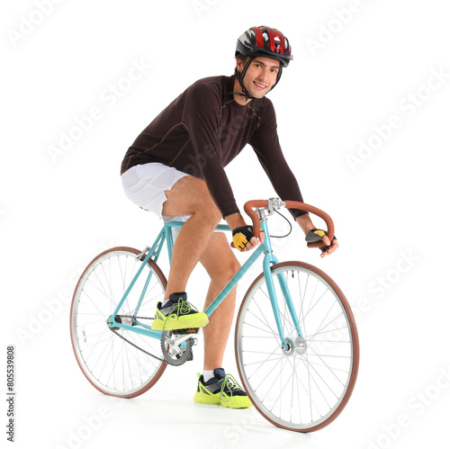 Young male cyclist riding b...