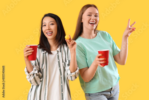 Female friends with beer an...