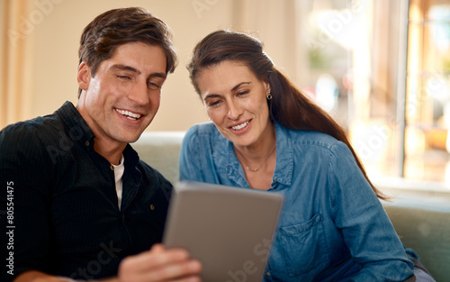Planning, couple and tablet to research in home with ideas for property, development or real estate. Mortgage, loan and people talk about marriage finance, budget or reading rent application on app © peopleimages.com