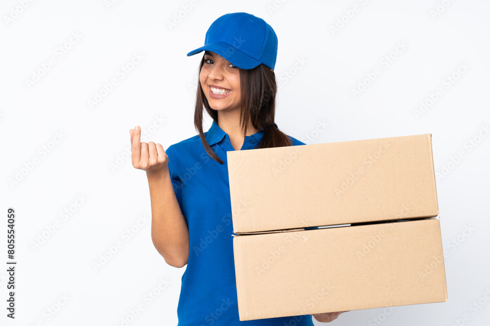 Young delivery brunette girl over isolated white background making money gesture Young delivery brunette girl over isolated white background making money gesture