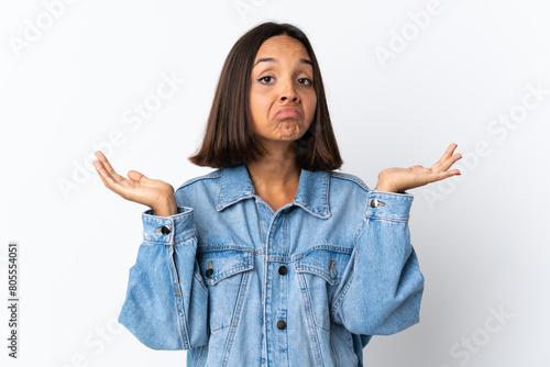 Young latin woman isolated on white background making doubts gesture