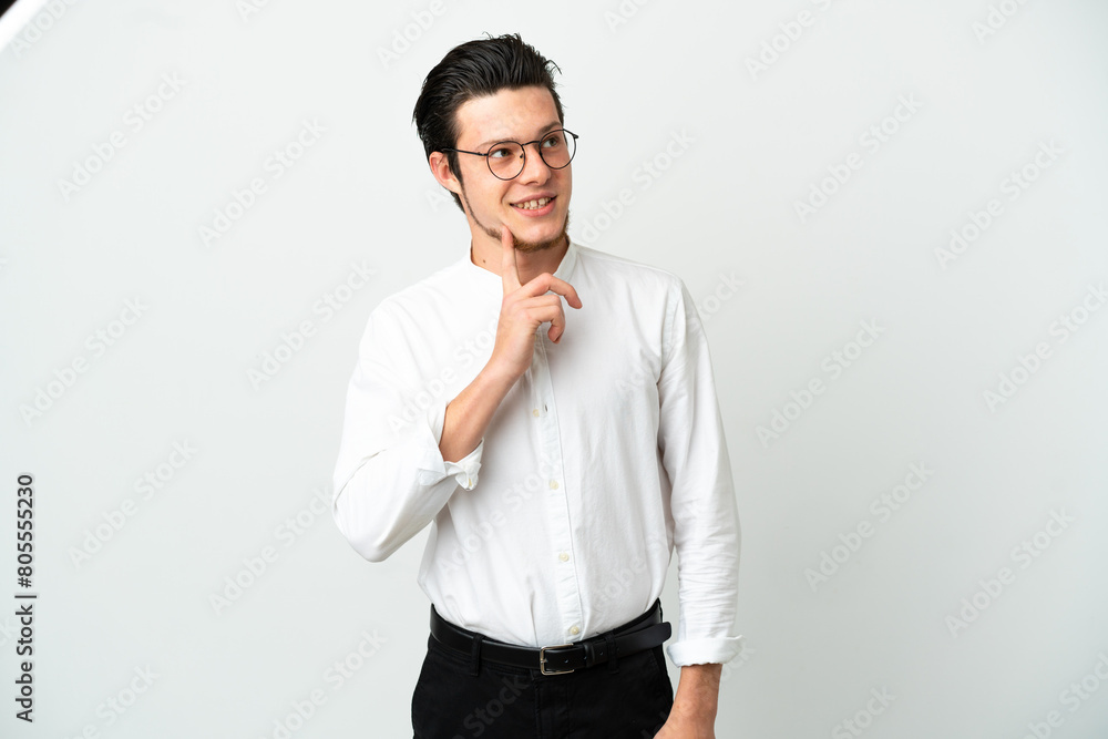 Russian Business man isolated on white background thinking an idea while looking up Russian Business man isolated on white background thinking an idea while looking up
