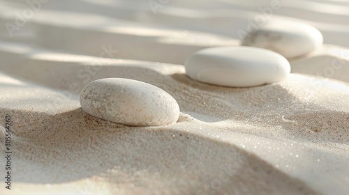  Beautiful white sand and three white round stones background 
