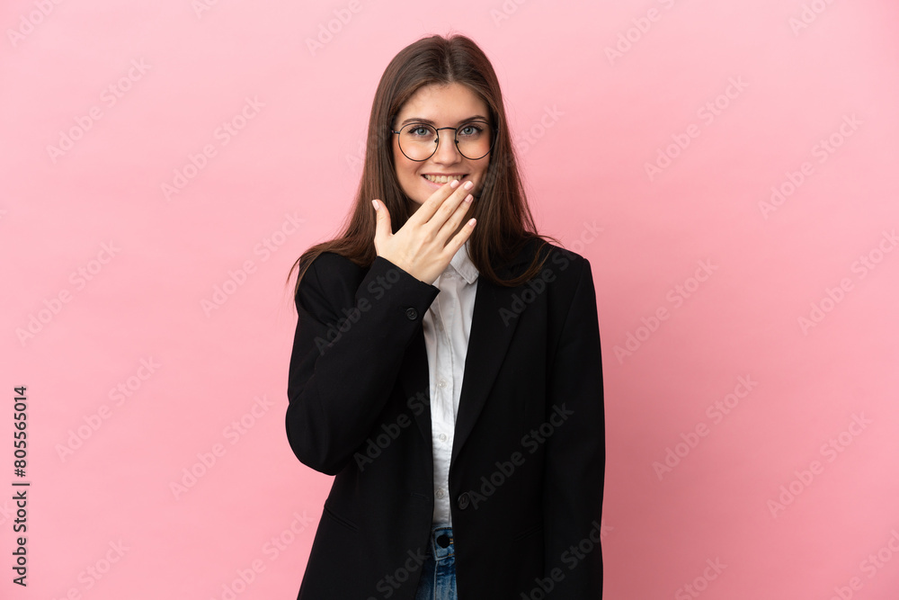 Young Business caucasian woman isolated on pink background happy and smiling covering mouth with hand Young Business caucasian woman isolated on pink background happy and smiling covering mouth with hand