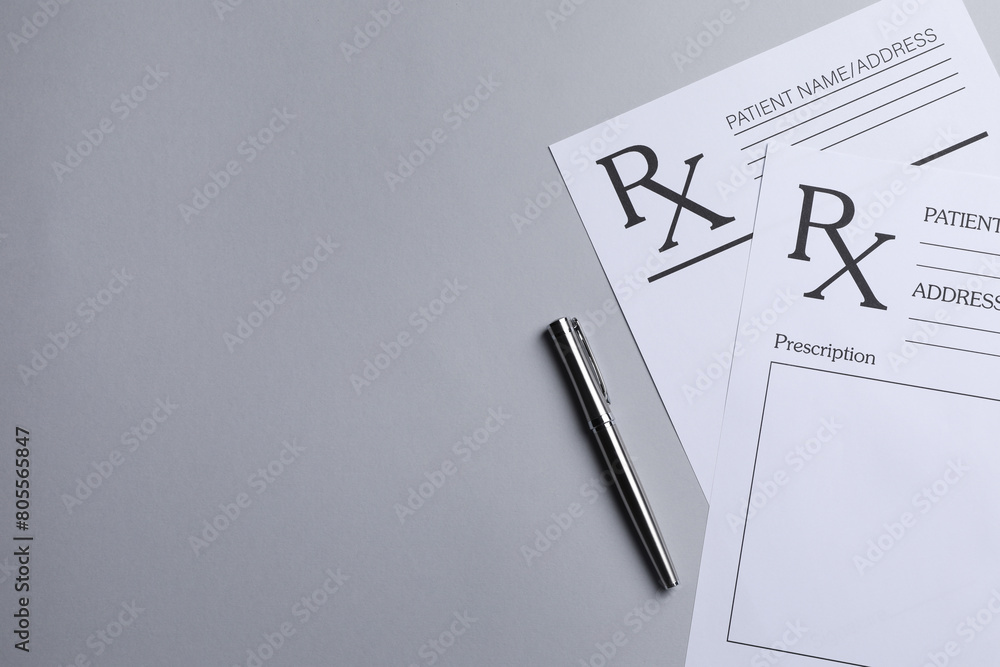 Medical prescription forms and pen on light grey background, flat lay. Space for text Medical prescription forms and pen on light grey background, flat lay. Space for text