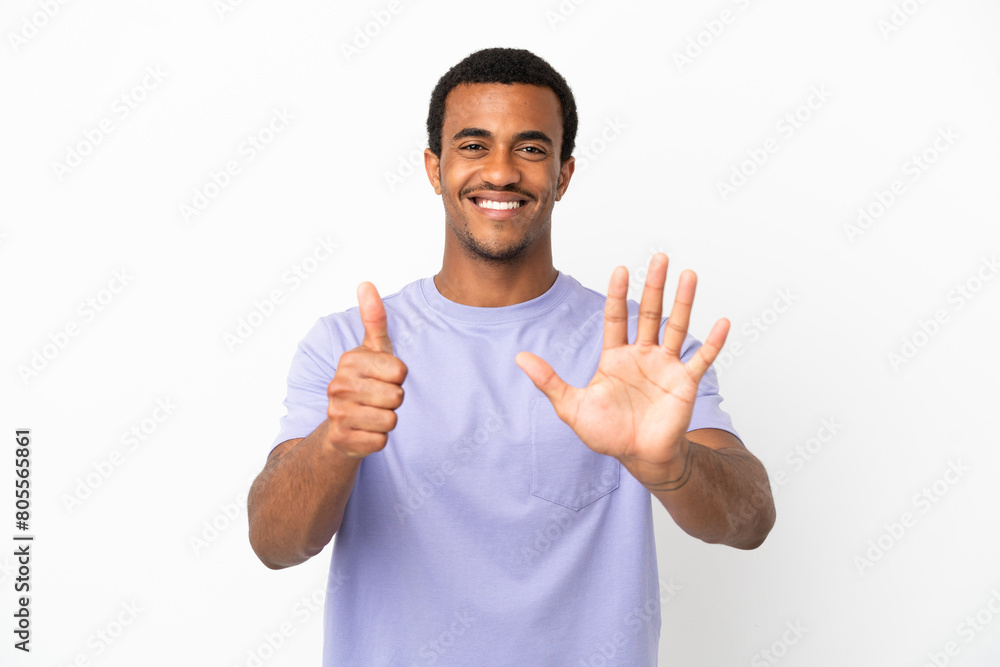 African American handsome man on isolated white background counting six with fingers African American handsome man on isolated white background counting six with fingers