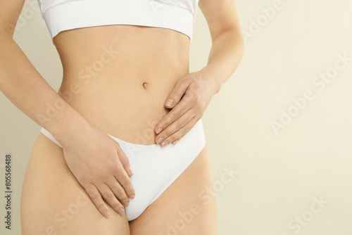 Gynecology. Woman in underwear on light background, closeup. Space for text