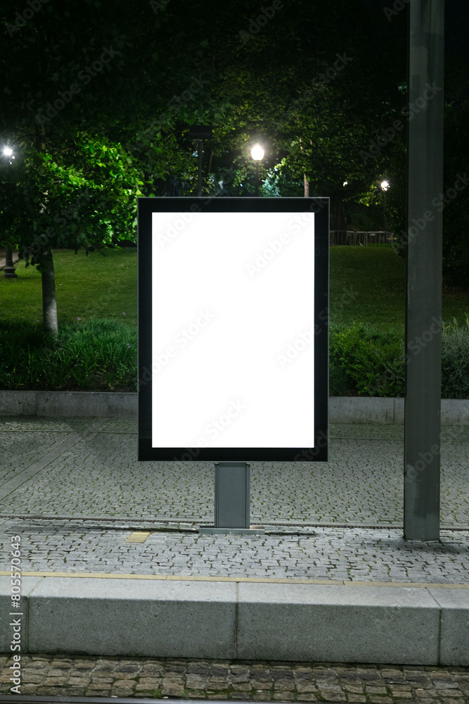 blank billboard at night in city, front view blank billboard at night in city, front view