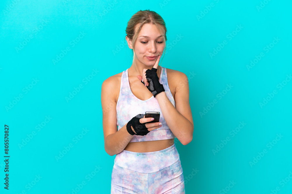 Sport caucasian woman isolated on blue background thinking and sending a message Sport caucasian woman isolated on blue background thinking and sending a message