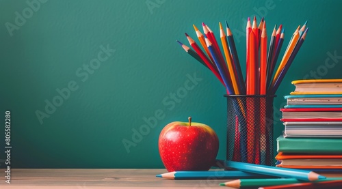 Books, Pencils, and Apple on Table