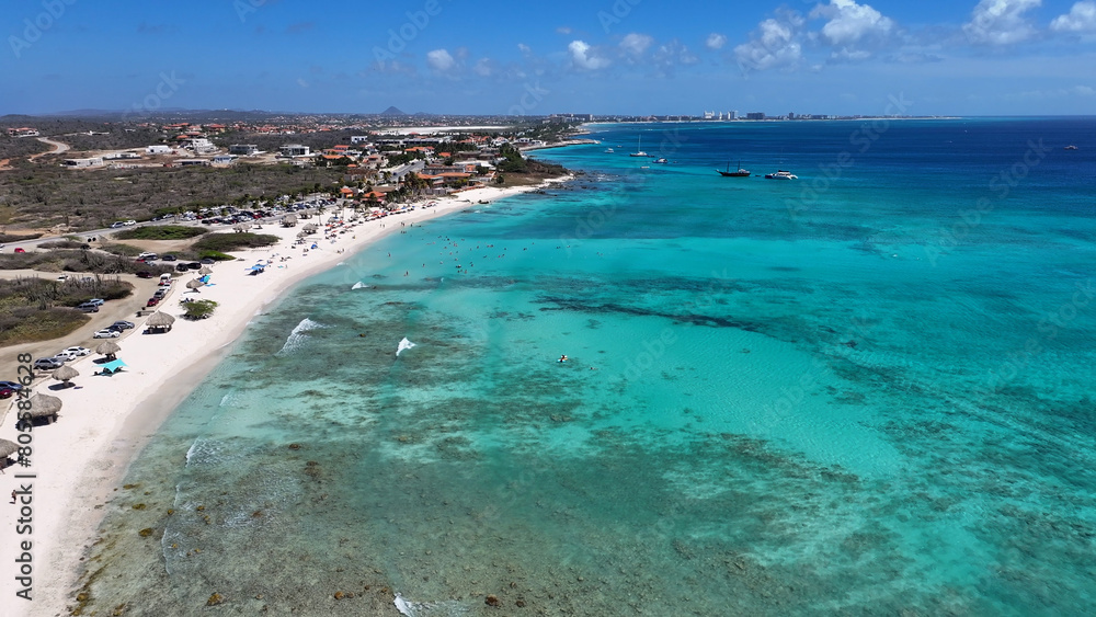 Arashi Beach At Noord In Oranjestad Aruba. Caribbean Beach. Blue Sea Background. Noord At Oranjestad Aruba. Tourism Landscape. Nature Seascape.