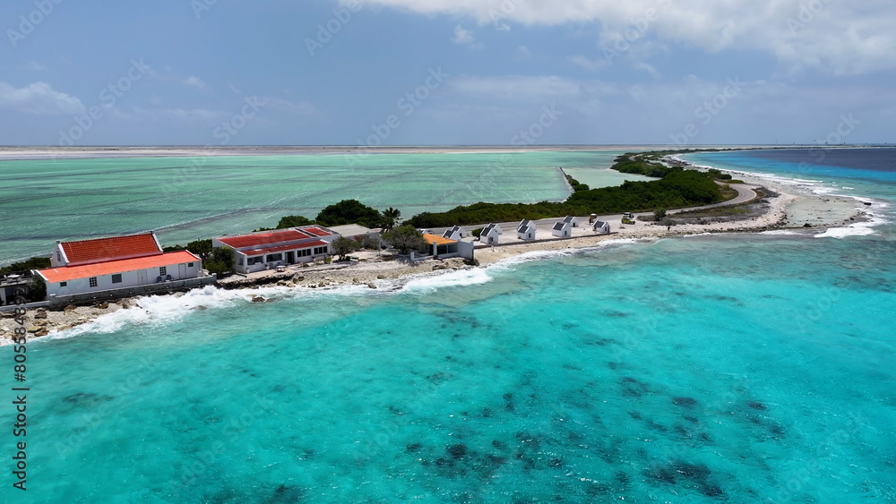 Obraz premium Old Slave Huts At Kralendijk In Bonaire Netherlands Antilles. Island Beach. Blue Sea Landscape. Kralendijk At Bonaire Netherlands Antilles. Tourism Background. Nature Seascape.