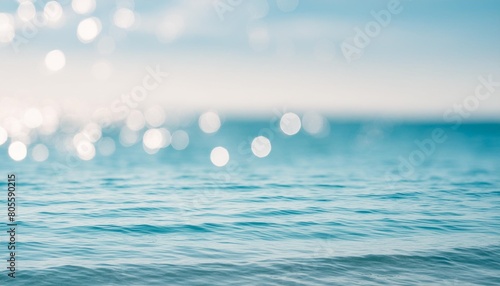 the smooth natural blue water background with bokeh abstract on the sea or ocean vintage and soft colored blur