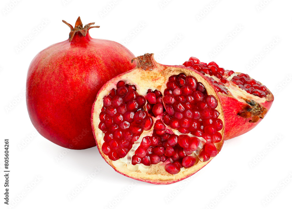 Halves and whole pomegranates isolated on white Halves and whole pomegranates isolated on white