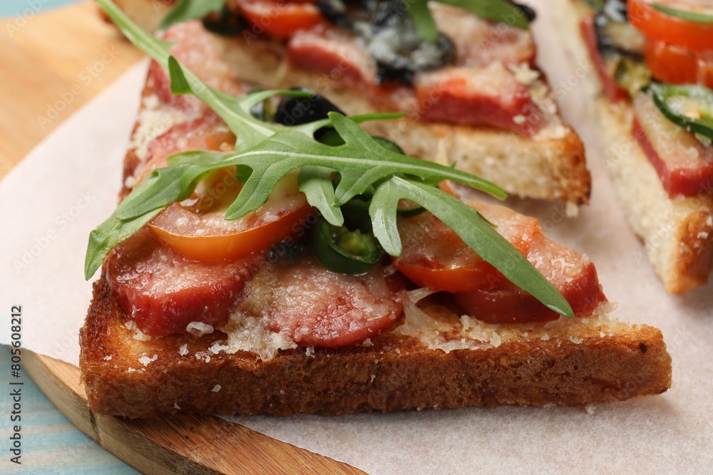Tasty pizza toasts on table, closeup view Tasty pizza toasts on table, closeup view