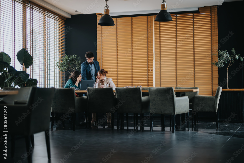 Three business professionals collaboratively discussing project details, costs, and strategic solutions in a contemporary meeting setting.