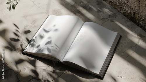 Open book with shadow on concrete background. photo