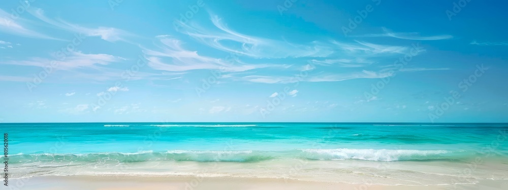 Obraz premium Tranquil beach with turquoise waves and clouds. Calm seashore with blue sky and clear waters. Concept of nature, relaxation, tropical destinations, vacation. Wide banner. Copy space