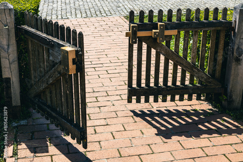 Wooden door fence for the entrance towards an old heritage house in the village of Kumrovec, home of Josip Broz Tito. photo