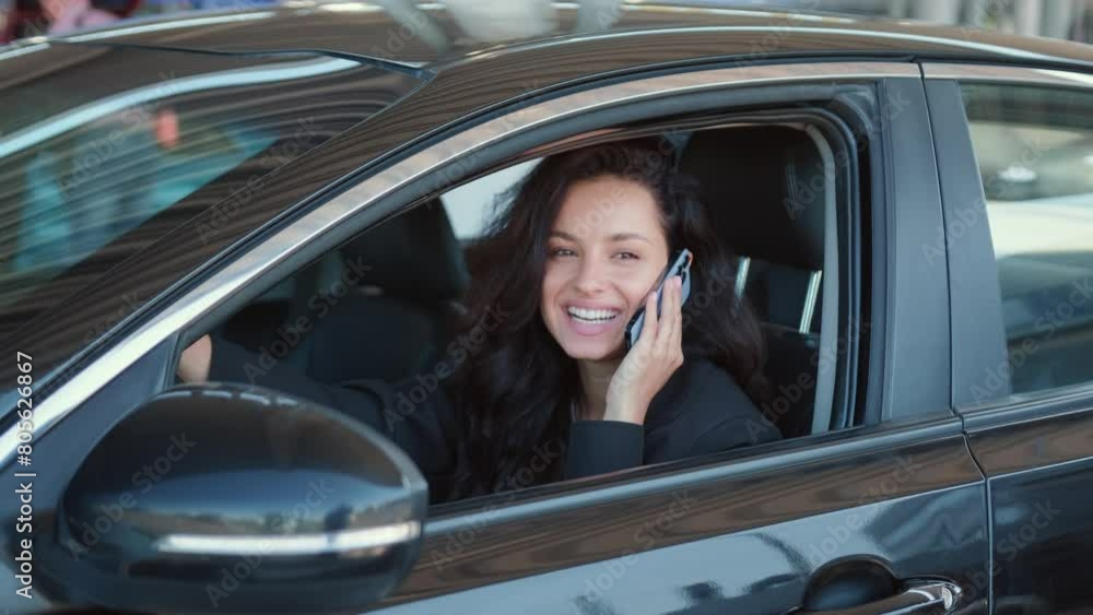 Pretty female in automobile ready to drive Pretty female in automobile ready to drive