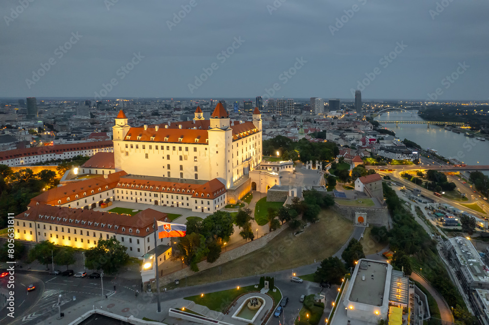 Naklejka premium Bratislava castle on the hill over Danube river at twilight, Slovakia
