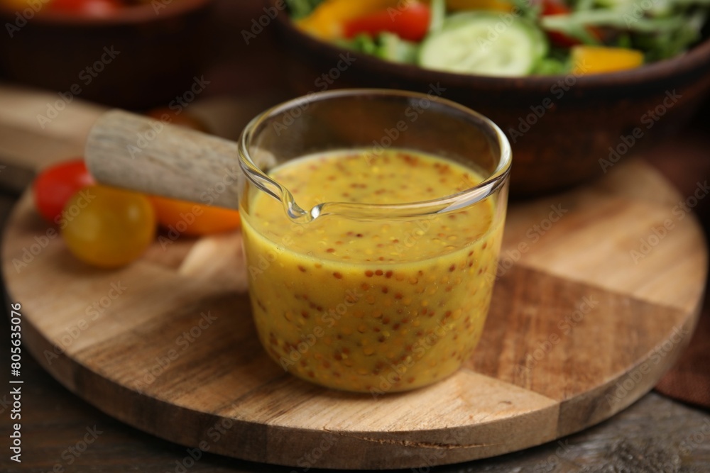 Tasty vinegar based sauce (Vinaigrette) on wooden table, closeup Tasty vinegar based sauce (Vinaigrette) on wooden table, closeup