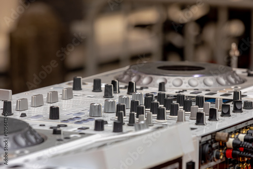 Wallpaper Mural Selective focus of Professional DJ player, DJ mixer to play record players like a musical instrument and create new sounds, To control and manipulate multiple audio signals, Music and recreation. Torontodigital.ca