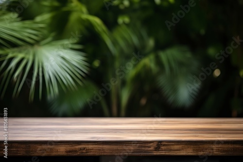 A wooden table with a leafy background
