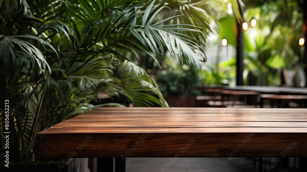 A wooden table with a plant in front of it A wooden table with a plant in front of it