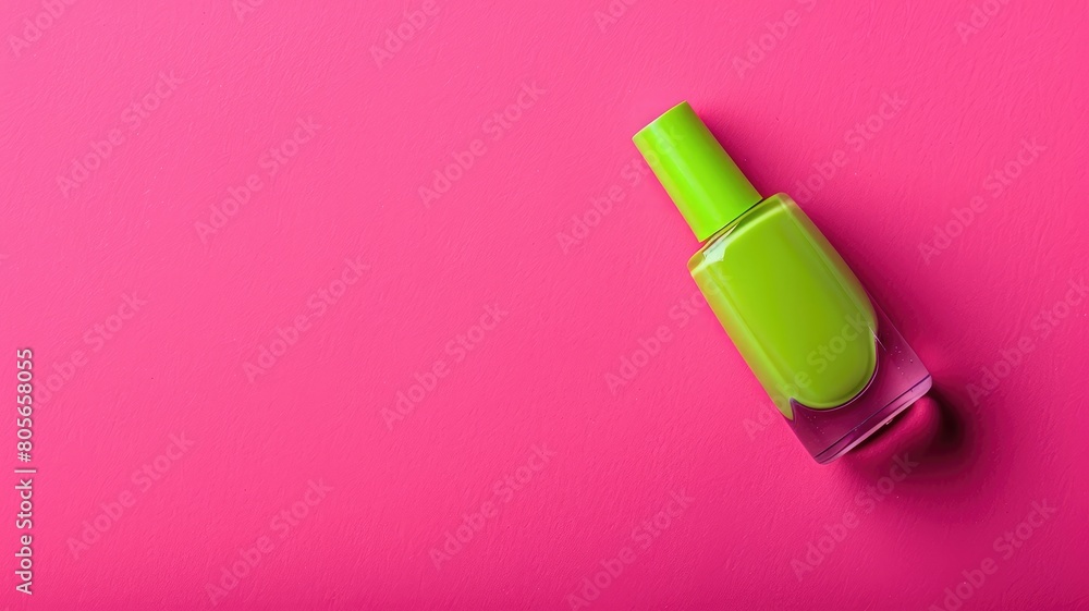 Bright green nail polish bottle on pink background Bright green nail polish bottle on pink background