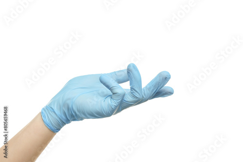 Doctor wearing light blue medical glove holding something on white background, closeup photo