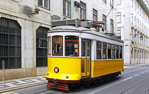 Typical yellow tram on the street of Lisbon, Portugal
