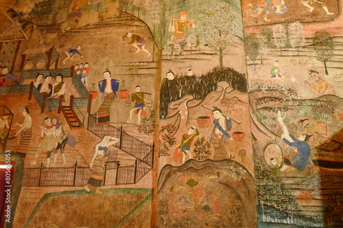 The ancient mural painting at the wall in Buddhist chruch of  Wat Phumin in Nan Province, Northern of Thailand.