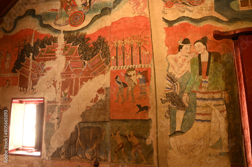 The most famous mural painting , name is Pu Man and Ya Man of a man whispering to the ear of a woman at Wat Phumin in Nan Province, Northern of Thailand.