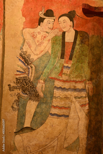 The most famous mural painting , name is Pu Man and Ya Man of a man whispering to the ear of a woman at Wat Phumin in Nan Province, Northern of Thailand.