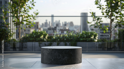 A black round table sits on a balcony overlooking a city
